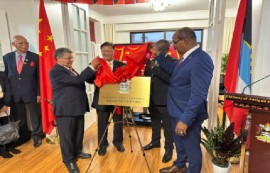Prime Minister Gaston Browne (extreme right) toasts the opening of the new Antigua and Barbuda embassy in China (Government photo)