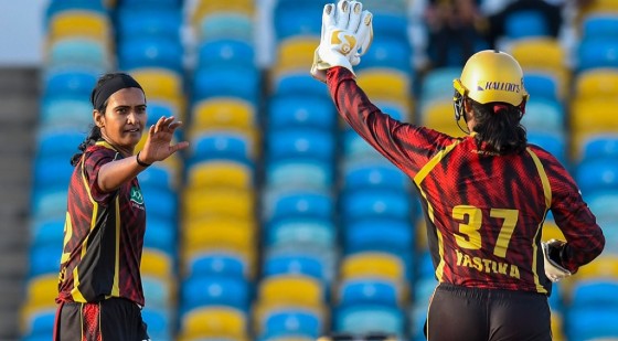 Shikha Pandey (left) celebrating one of her three wickets against the Barbados Tridents.