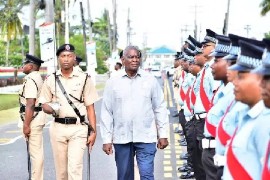 Minister of Home Affairs Robeson Benn inspects police officers during the opening of the 2025 Inspectors’ and Sergeants’ Conference. (Photo credit: DPI)