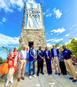 Officials mark the 100th anniversary rededication of the Blue Lagoon Island Watch Tower last week.