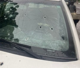 The bullet holes in his vehicle. (via Le Nouvelliste)