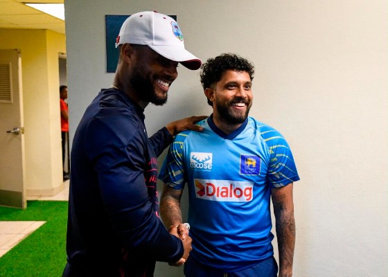 West Indies captain Shai Hope (left) and Sri Lanka skipper Kusal Mendis share a laugh during the third and final ODI on Monday, which was abandoned without a ball being bowled. (Photo courtesy Randy Brooks/Getty Images).