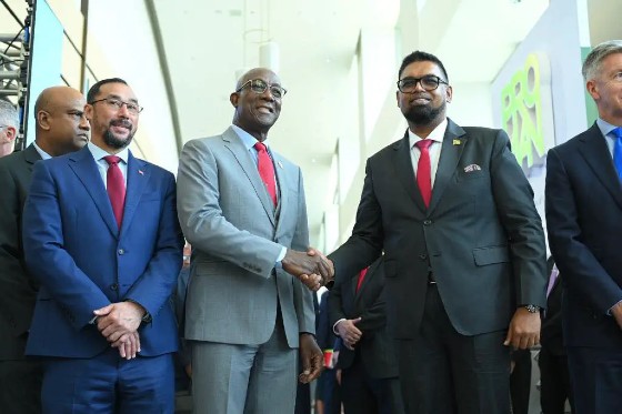 Trinidad's Prime Minister Keith Rowley and Energy Minister Stuart Young greet Guyana's President Irfaan Ali  at the 2023 Trinidad and Tobago Energy Conference.