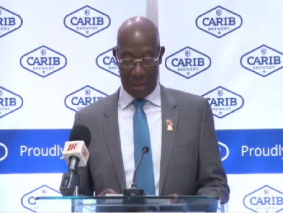 Prime Minister Dr. Keith Rowley addressing the ceremony for the commissioning of a new line at Carib Beer (CMC Photo)