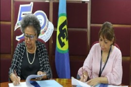 CARICOM Secretary General Dr. Carla Barnett (left) signing agreement with CAC executive secretary Lucrecia Rodríguez Peñalba, (CARICOM Secretariat photo)