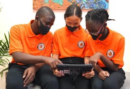 Carol City Middle School students try out one of the new iPads that are part of the Middle School Redesign initiative.