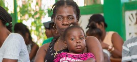 Mothers wait with their children to be vaccinated at a UNFPA-suppoted hospital in southern Haiti. (UNFPA/Ralph Tedy Erol)