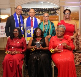 Awardees from left to right – Dorothy Edwards, Sharon Hall, Jennilyn Hines – display their awards for outstanding contributions to education, after being honored at the 11th Annual Gala of the Cedric Titus High School North American Past Student Association. The event was held at the Pines Manor in Edison, New Jersey. Sharing in the spotlight from left to right are Andrew Titus, grandson of Mr. Cedric Titus for whom the school is named; his brother Raye Titus; his sister Faye Titus; and the President of the Association, Dr. Avril Keldo. (Derrick Scott photo)