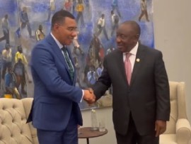 Prime Minister Andrew Holness (lefty) being greeted by South African President, Cyril Ramaphosa, at the G20 summit (Photo courtesy X account of PrimeMInister Holness