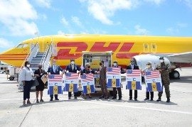 Diplomats at the US Embassy in Bridgetown welcome the US' 1st shipment of vaccines to Barbados on August 13th. (Photo from the US Embassy in Barbados)