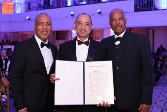 L-R: Chairman of GraceKennedy Limited, Professor Gordon Shirley, GK Group CEO, Don Wehby, and Vice-Chancellor of the University of the West Indies, Sir Hilary Beckles at the 2022 American Foundation of tthe University of the West Indies (AFUWI) Annual Legacy Awards Gala on April 21 in NYC. Wehby is holding the Congressional Proclamation from the US House of Representatives received by GK in recognition of its 100th anniversary.