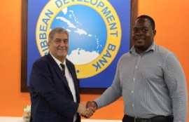 Dr. Sherine Ibrahim, Sustainable Energy Specialist, Caribbean Development Bank, and Kyle Farnum, Programme Manager, Energy, European Union, attend the launch of the Caribbean Regional Electricity Grid Interconnection and Renewable Energy Scaling Technical Assistance Project.