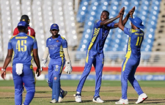 Dominic Drakes (second right) celebrating one of his four wickets against the Trinidad and Tobago Red Force. (Photo courtesy CWI Media) Boucher then joined in on the action by hitingt Ricky Jaipaul for two boundaries in the fourth over.