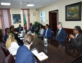 Prime Minister Dr. Terrance Drew, at the top of the table, leads his Cabinet delegation to the meeting with members of the APPG .