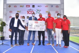 L-R: Chairman of the ISSA Boys & Girls Champs Committee, Richard Thompson and Colleen Montague, Vice President of ISSA joined ISSA President, Keith Wellington in receiving a cheque for J$88 million from Don Wehby, Group CEO at the 2022 Champs Launch on March 21 at the National Stadium. Frank James, CEO of GK Foods – Domestic, Mariame McIntosh Robinson, President & CEO of FGB, and Grace Burnett, CEO of GKFG and President & CEO of GKMS, who are associate sponsors of the event, also joined in the handover.