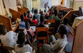 Edens Désir, teaching a class in Haiti (IOM/Antoine Lemonnier Photo)