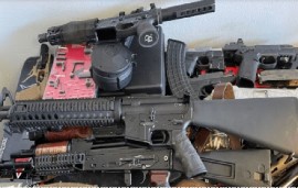 Weapons seized by US law enforcement authorities which were destined for Haiti are put on show. ( CPB/HIS Photo)