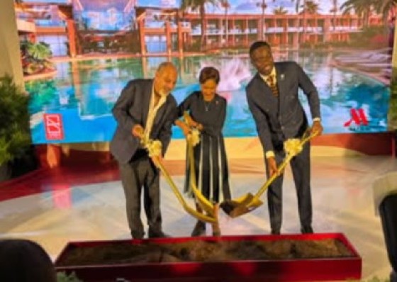 Prime Minister Kamla Persad-Bissessar flanked by Tobago Chief Secretary, Farley Augustine (right) and Superior Hotels chairman John Aboud at he sod turning ceremony in Tobago for the TT$500 million hotel