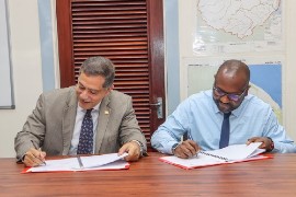 IICA’s Representative in Guyana, Wilmott Garnett (left) and Permanent Secretary in the Ministry of Health, Malcolm Watkins signing the agreement early on Wednesday.