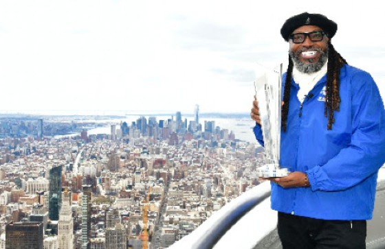 Chris Gayle poses with the ICC T20 World Cup trophy at the Empire State Building in New York.