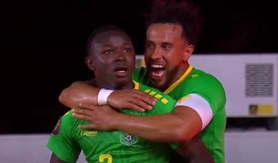 Omari Glasgow celebrates his goal on Saturday with a Guyana teammate.