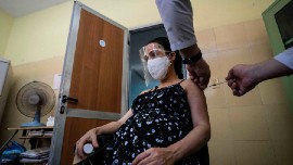 A pregnant woman receives a dose of COVID-19 vaccine in Havana last summer. (Photo courtesy of Ramon Espinosa/Associated Press)