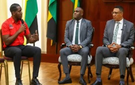 Prime Minister Andrew Holness (right) and Minister of State in the Office of the Prime Minister, Abka Fitz-Henley (center) listens to UWI Mona Campus Guild President, Keshawn McGrath during their meeting last weekend (JIS)
