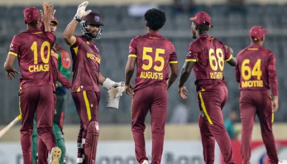 West Indies captain Shai Hope (with helmet) celebrates with teammates after they defeated Bangladesh in the Super Over in the second ODI.