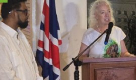 President Irfaan Ali looks on as outgoing British diplomat, Jane Miller, addresses Friday night’s ceremony.