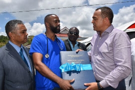 Physiotherapist at the PJH, Roosevelt Carty (2nd left) presents the stroke registry to Minister of Health and Wellness, Dr. Christopher Tufton at a previous event at the hospital. Looking on are: Vice Chairman of the SRHA Board, Michael Stern (left) and board member, Dr. St. Aubyn Bartlett.
