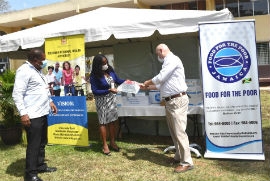 Director at Food for the Poor Jamaica, Craig Moss-Solomon (right) and SRHA Regional Technical Director, Dr. Vitillius Holder (centre) examine one of the donated items, while Regional Director, Michael Bent for the SRHA looks on.