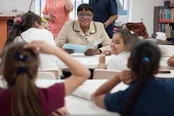 Chairwoman Audrey M. Edmonson reads to students at the Latinos United After-School Program in Allapattah. (Photos by Ryan Holloway / Miami-Dade County)