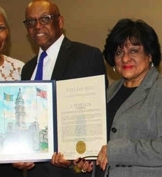 Retired Judge Emille Cox, left, receives a proclamation from Philadelphia Councilwoman Jannie L. Blackwell.