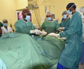 A team of doctors perform a bilateral inguinal hernia surgery in April 2019 at the Mandeville Regional Hospital. 