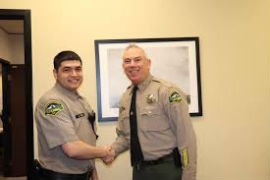 Sheriff Snaza congratulates a newly sworn corrections deputy on Feburary 3, 2020. (Thurston County Sheriff's Office photo)