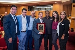 Commissioner Diaz accepts an award from Venezuelan-American activist Helen Villalonga, far right, and members of her organization Amevex. (Photo by Armando Rodriguez / Miami-Dade County)