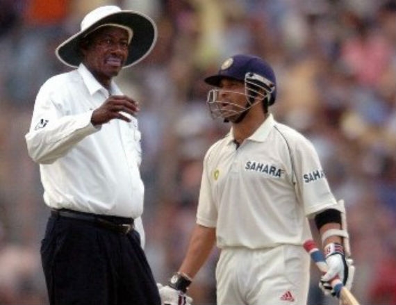 Bucknor, left, listens to Tendulkar during the 2005 Eden Gardens Test.