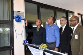 May Pen Hospital to Save Millions Annually From New AC System: Minister of Science, Energy and Technology, Fayval Williams (left) cuts the ribbon to unveil a plaque installed on the Administrative Building at the May Pen Hospital in Clarendon, to signal the completion of an energy efficient air conditioning system valued at $73 million and which will result in annual savings of $5.2 million at the hospital. Minister of Health and Wellness, Dr Christopher Tufton (2nd left), Chairman of the PCJ, Russell Hadeed (2nd right) and Chief Executive Officer of the May Pen Hospital, St. Andrade Sinclair.