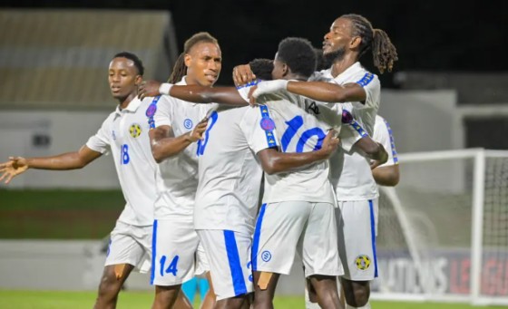 Saint Lucia players celebrate after scoring one of their five goals against Bermuda.