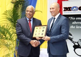 Colonel Desmond Edwards, Director General of the Major Organised Crime and Anti-Corruption Agency presents an appreciation award to Michel Drayton, Inspector of Advanced and Specialized Police Training at the Canadian Police College (CPC) to acknowledge the partnership between the Canadian Police College and MOCA on the Polygraph Examiners Training Course.