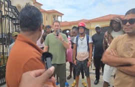 Part of the crowd at Azruddin Mohamed’s residence when GRA officers went there on Saturday