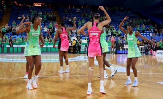 The six Jamaican players involved in the Super Netball League match between leaders West Coast Fever and defending champions Adelaide Thunderbirds share a dance after their contest last Saturday at the RAC Arena in Perth, Australia. (SNL photo)