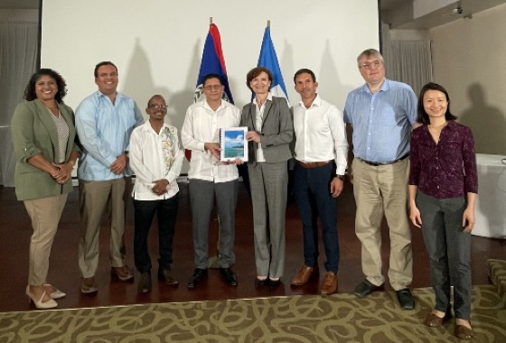 Government of Belize representatives (Left) receive PER from World Bank Team (Right)