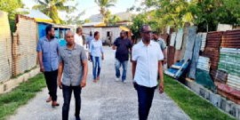 Prime Minister Phillip J Pierre (right) walking through Bruceville in Vieux Fort on Monday (Photo courtesy PM Facebook )