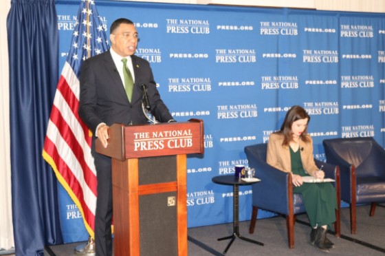 Prime Minister Andrew Holness addresses members of the National Press Club at its headquarters in Washington DC on Friday April 1. At right is Treasurer and moderator Emily Wilkins who interviewed Prime Minister Andrew Holness. (Photo by Derrick Scott)