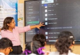 Education Minister Priya Manickchand with students from Abram Zuil Secondary who signed up for the platform