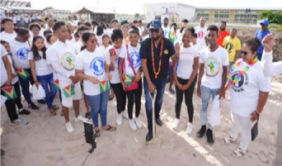 President Irfaan Ali surrounding by young people during the commissioning of the project (DPI Photo)