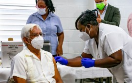 Public workers get vaccinated in Belize. San Pedro Sun photo.