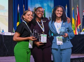 Jolé St. John of Tobago (center) with Jamaica’s Caleader Lewison (left) and Aylani Morris Seymour from the Cayman Islands in Barbados.