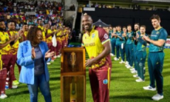 Andre Russell (right) receives a token of appreciation from Jamaica’s Minister of Sport, Olivia Grange prior to the start of the second T20I against Australia.